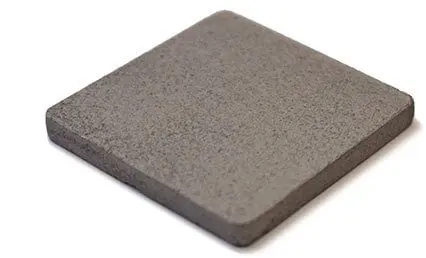 A square, gray, flat ceramic tile with slightly rounded edges on a white background.