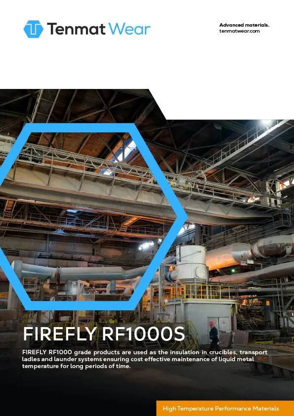 Interior of an industrial facility with machinery and metal structures under a high roof.