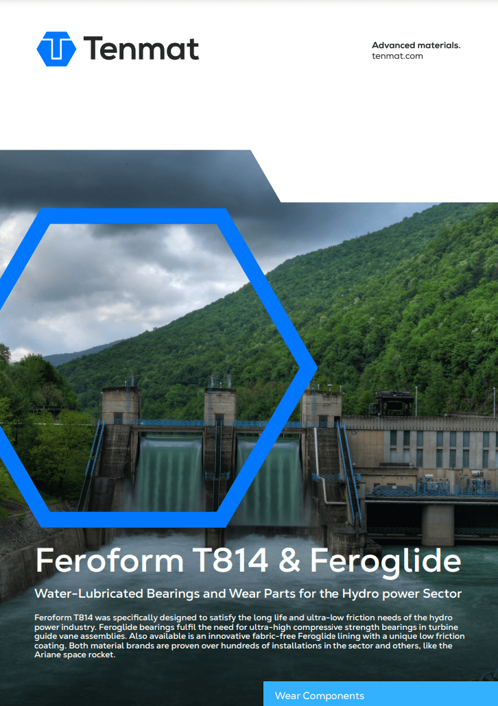 A large hydroelectric dam surrounded by green hills, promoting Tenmat water-lubricated bearings and wear parts.