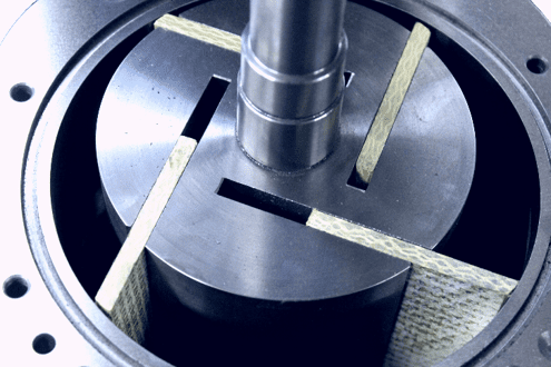 Close-up of a rotary vane pump showing metal rotor, vanes, and cylindrical housing.