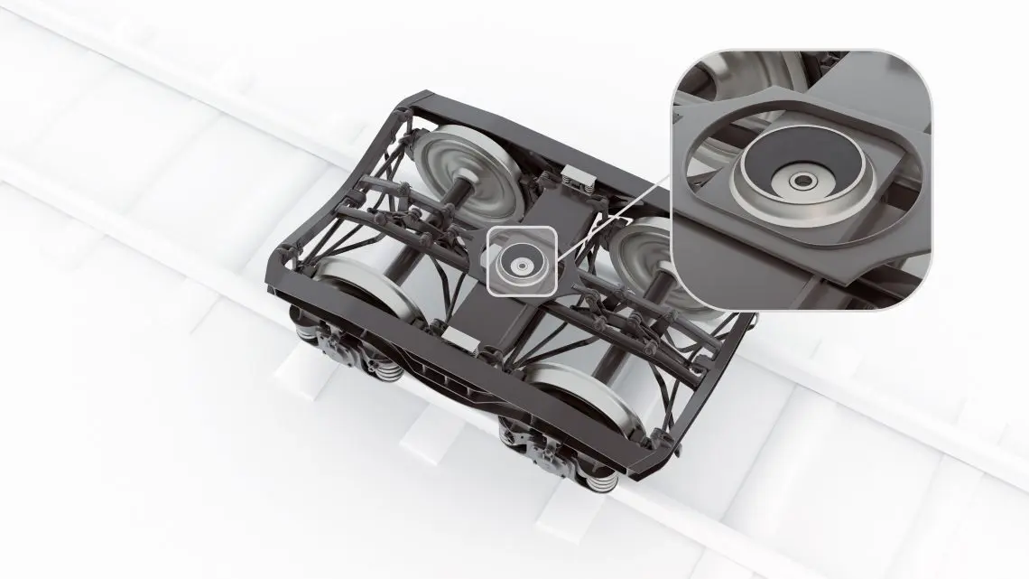 09-wp-centre-pivot-liner-cpl-rail-tds-in-situ1 Overhead view of a train wheel assembly on tracks with a zoomed-in detail of the central component.