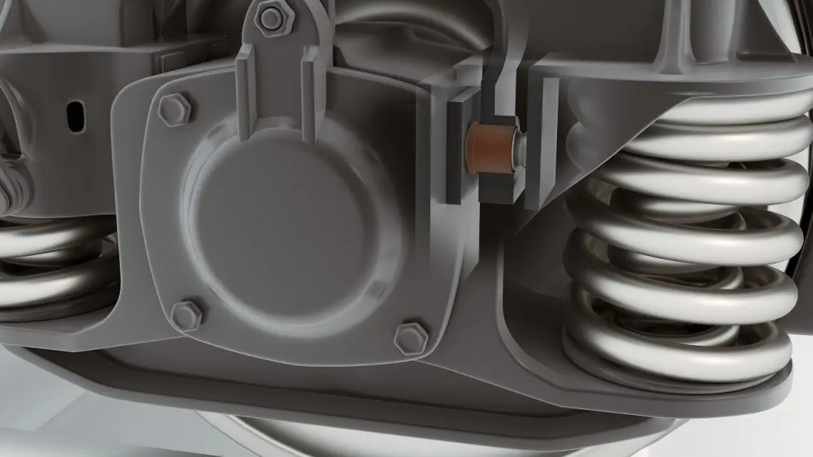 16-wp-friction-damper-bushes-rail-tds-in-situ2-v2 Close-up view of a metal mechanical part with springs, bolts, and a round central cover.