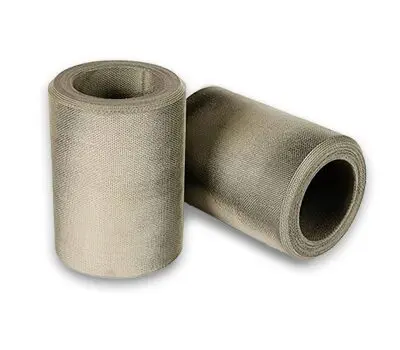 Two rolls of gray industrial fabric or mesh material, one standing upright and one lying on its side.