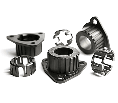 Several black metal automotive or mechanical parts with cylindrical and flange shapes on a white background.