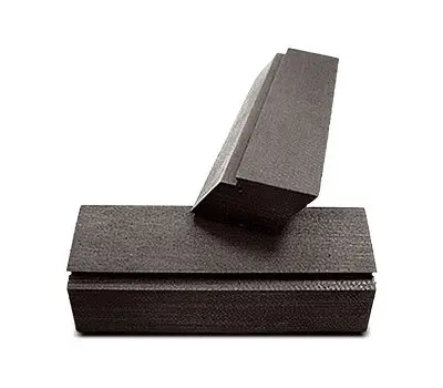 Two rectangular black foam blocks, one standing upright and leaning on the other, isolated on a white background.