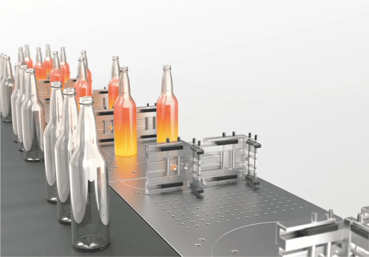 vitronus-campaign-03 Empty and partially filled bottles move along a metal conveyor belt in a factory setting.