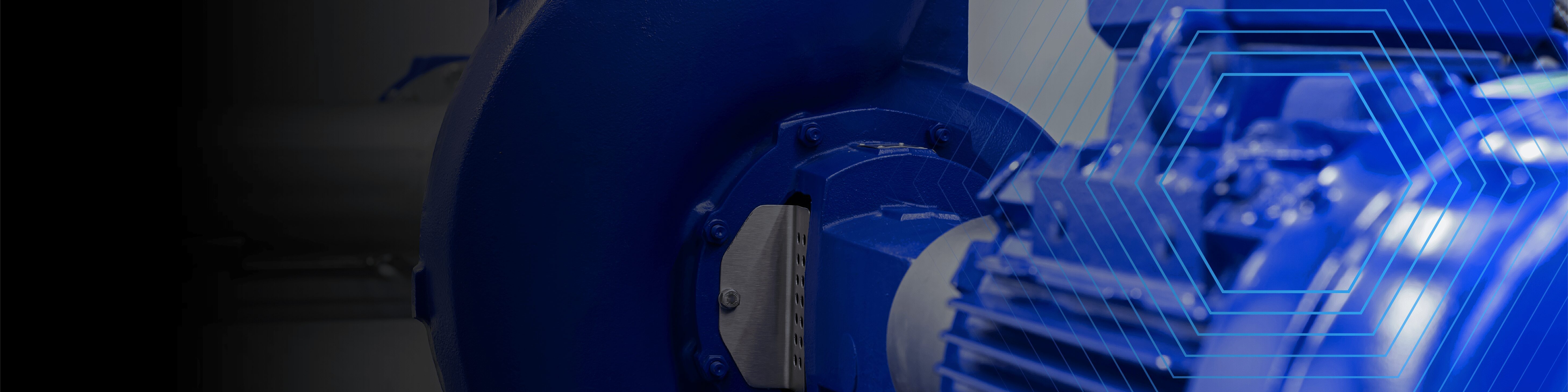Close-up of blue industrial machinery with hexagonal graphic overlays on the right side.
