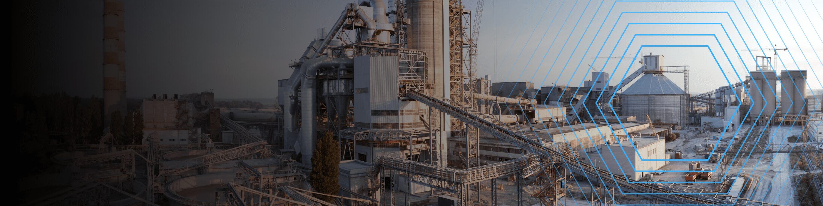 Industrial complex with large silos, towers, and conveyors under a clear sky, overlaid with blue hexagonal lines.
