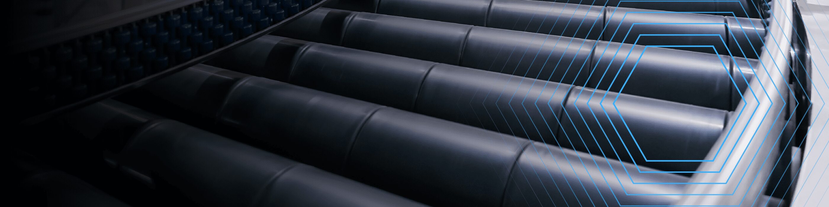 Close-up of industrial conveyor belt rollers with geometric blue lines overlayed.